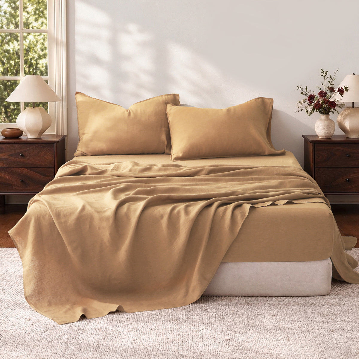 Sandy Beige 100% linen sheet set displayed on a bed, with natural fabric wrinkles illuminated by soft sunlight.