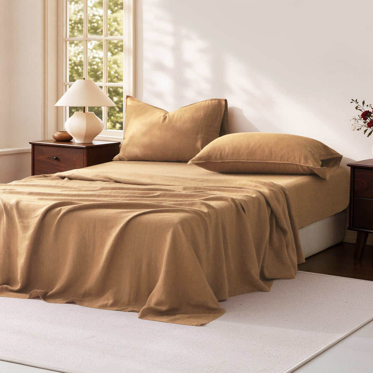 Sandy Beige 100% linen sheet set displayed on a bed, with natural fabric wrinkles illuminated by soft sunlight.