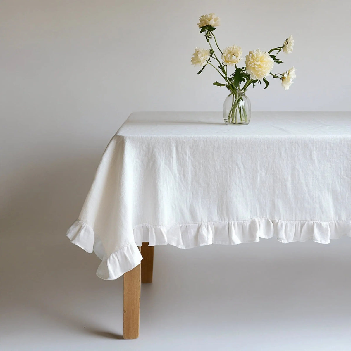 Close-up of flowing ruffles on the White Linen Tablecloth - Linen Times