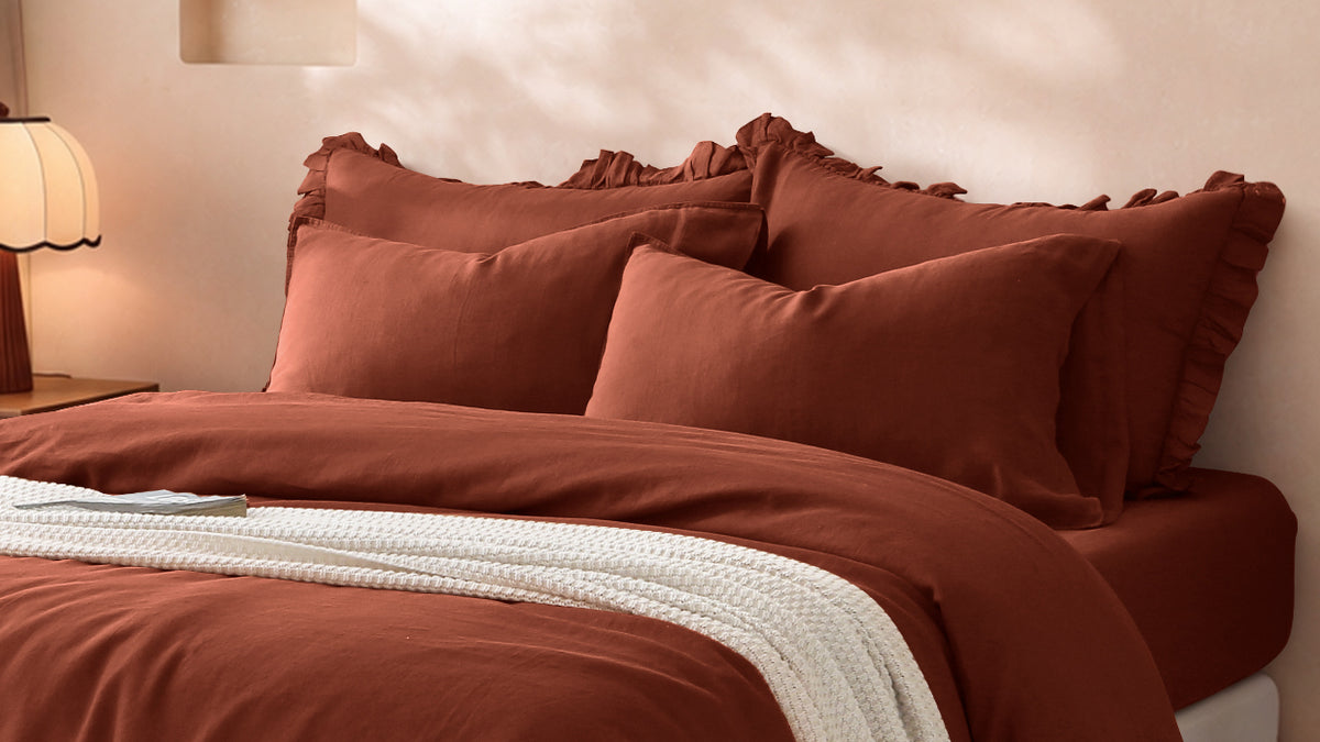 Natural linen bedding in a sunlit bedroom